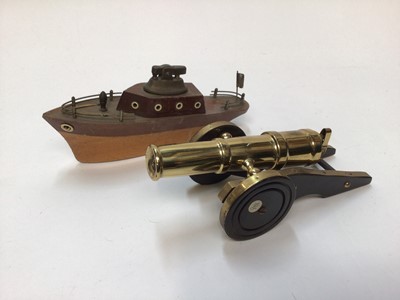 Lot 2454 - Novelty lighter in the form of a cannon and another in the form of a boat (2)