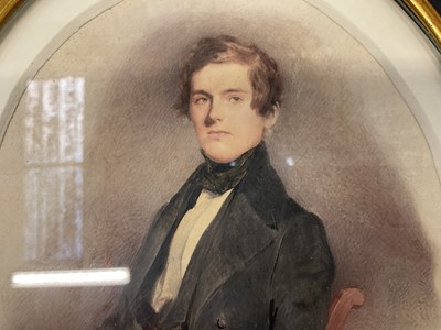 Lot 853 - Manner of David Wilkie (1785-1841) watercolour, Portrait of a young man seated, 19 x 14cm, oval, in glazed ebonised frame, label verso 'Sir David Wilkie, died at sea 1841, picture painted Aug 19, 1...