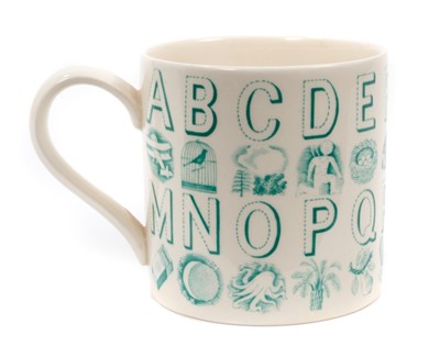 Lot 123 - Eric Ravilious for Wedgwood, an alphabet mug in green on a cream ground, 8.5cm high