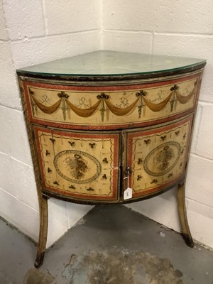 Lot 1449 - Adams style polychrome painted pine corner washstand, painted with swags and grapes, enclosed by pair of doors on swept supports, early 19th century, 63cm wide x 42cm deep x 82cm high