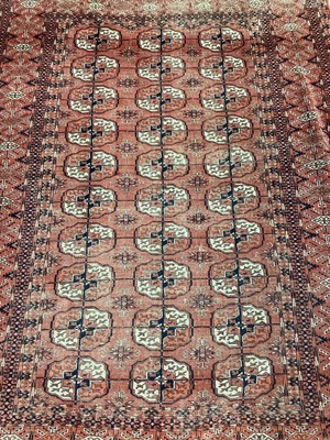 Lot 1504 - Tekke Turkoman rug, having three rows of ten quartered guls, in multiple geometric borders, 147 x 208cm