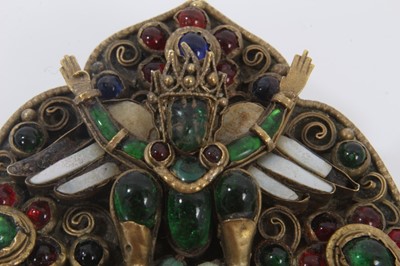 Lot 491 - Antique Indian brooch, believed to represent Garuda, probably Newar People, Kathmandu Valley, Nepal. The multi coloured glass gem stones in gilded brass setting. 53mm x 65mm.