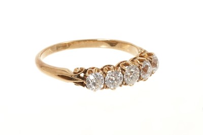 Lot 519 - Late Victorian diamond five stone ring with five graduated old cut diamonds in gold claw setting with scroll shoulders on plain gold shank, estimated total diamond weight approximately 0.75cts, rin...