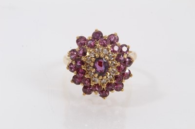 Lot 509 - 1970s ruby and diamond cluster ring in 18ct gold setting