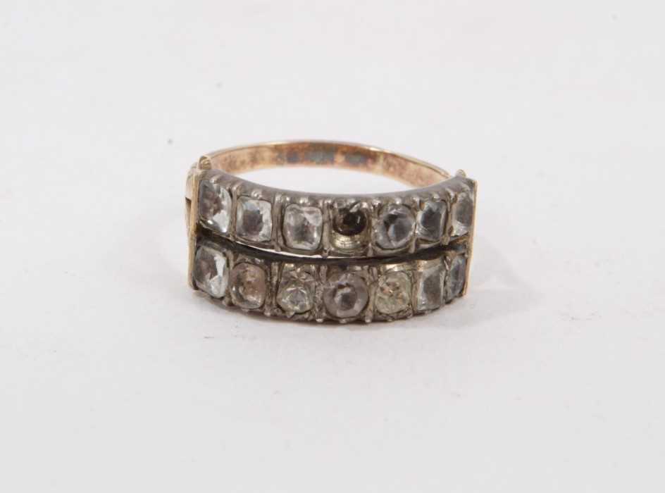 Lot 409 - George III gold and paste ring with two rows of paste stones in closed-back silver collet setting on bifurcated gold shoulders on reeded gold shank. Ring size L½.