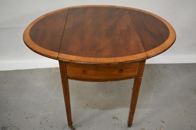 Lot 1107 - George III mahogany and satinwood cross banded oval Pembroke table with drawer on inlaid square taper legs terminating on brass castors