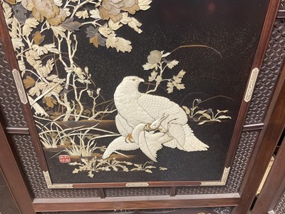 Lot 1406 - Fine quality Japanese Meiji period hardwood and shibayama inlaid two fold screen, with ornate panels of birds and foliage, the left central panel with signature plaque, within gently arched lattice...