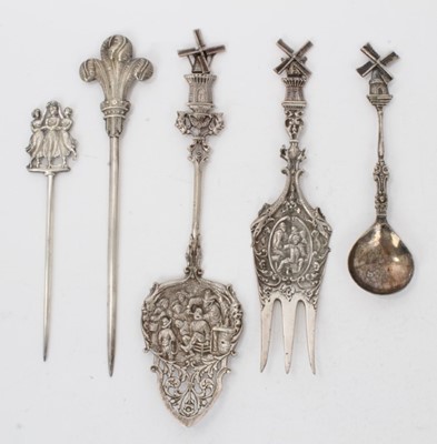 Lot 373 - Collection of Dutch and other Continental silver and white metal, including a Windmill serving slice, embossed with a scene of a man having a tooth extracted and a Windmill serving fork with a Tave...