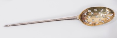 Lot 374 - Mid 18th century Mote spoon, with fancy heel and pierced bowl, engraved on the reverse E over W S, traces of marks on reverse of stem. 12.8cm overall length.