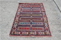 Lot 1209 - Persian-style rug centred by seven geometric...
