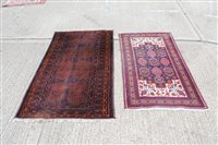 Lot 1210 - Eastern rug with chocolate-brown ground,...