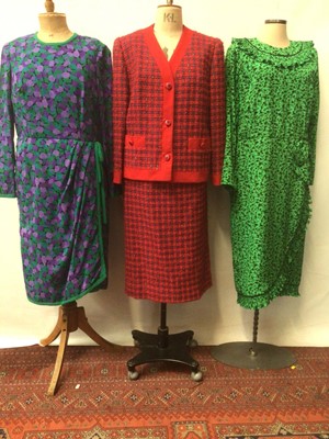 Lot 2068 - Ian Thomas Royal dressmaker, red and blue boucle wool tweed skirt suit also by Ian Thomas a green silk occassion dress with false wrap over front, finely pleated ruffle trim to edges and bow at wai...