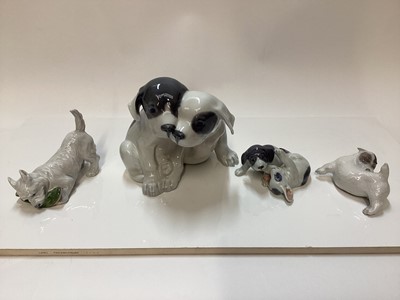 Lot 1115 - Four Royal Copenhagen porcelain models of Dogs, number 260, 058, 3476 and 3080