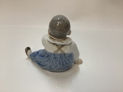 Lot 1116 - Three Royal Copenhagen porcelain figures - boy on marrow number 4539, girl with doll number 1938 and baby number 1517