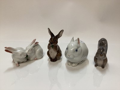 Lot 1118 - Three Royal Copenhagen porcelain models of Rabbits number 4705, 578 and 1019 together with a Squirrel number 982 (4)