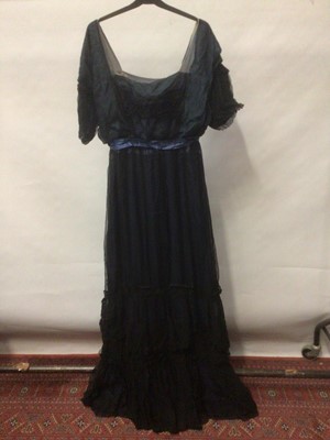 Lot 2051 - 1920s high waist evening dress in blue silk with black silk chiffon outer layer,  ruffled edging and lace and bead embellishments.  Made by Elise Poret,  Rue Des Capucines Paris.