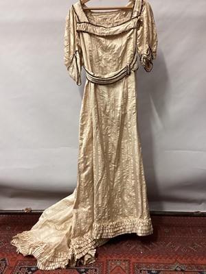 Lot 2052 - Edwardian evening gown in cream silk with drooping short sleeves and train.  Waist, cuffs and neckline edged with paste stones.  Plus a lilac satin evening dress..