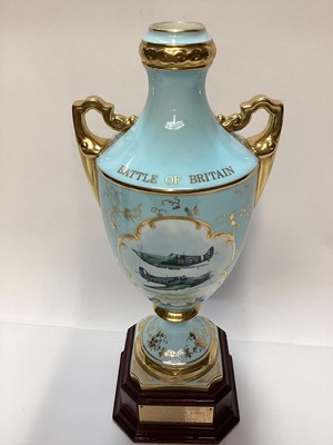 Lot 1123 - Coalport limited edition Battle of Britain two handled vase hand painted by Malcolm Harnett, number 10 of 50, on plinth base, 32cm high, together with a pair of Royal Worcester blue and gilt vases,...