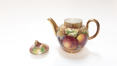 Lot 1144 - Miniature Royal Worcester teapot with hand painted fruit study signed J. Sherratt, together with matching cup and saucer,  and another cup and saucer signed T. Nutt