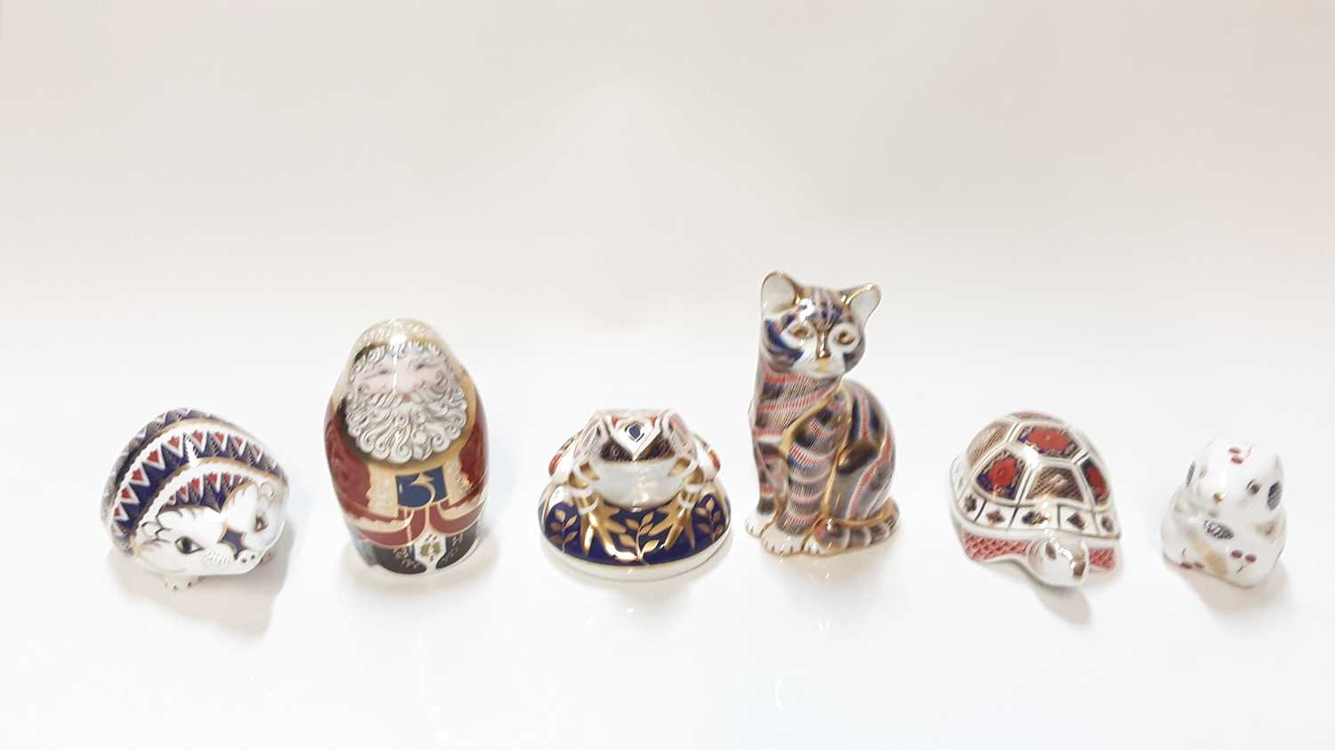 Lot 1162 - Six Royal Crown Derby Imari paperweights including Father Christmas, Cat, Tortoise etc