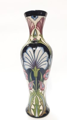 Lot 1173 - Moorcroft pottery Trial vase decorated with blue and pink flowers, dated 17-8-09, 31cm high, boxed
