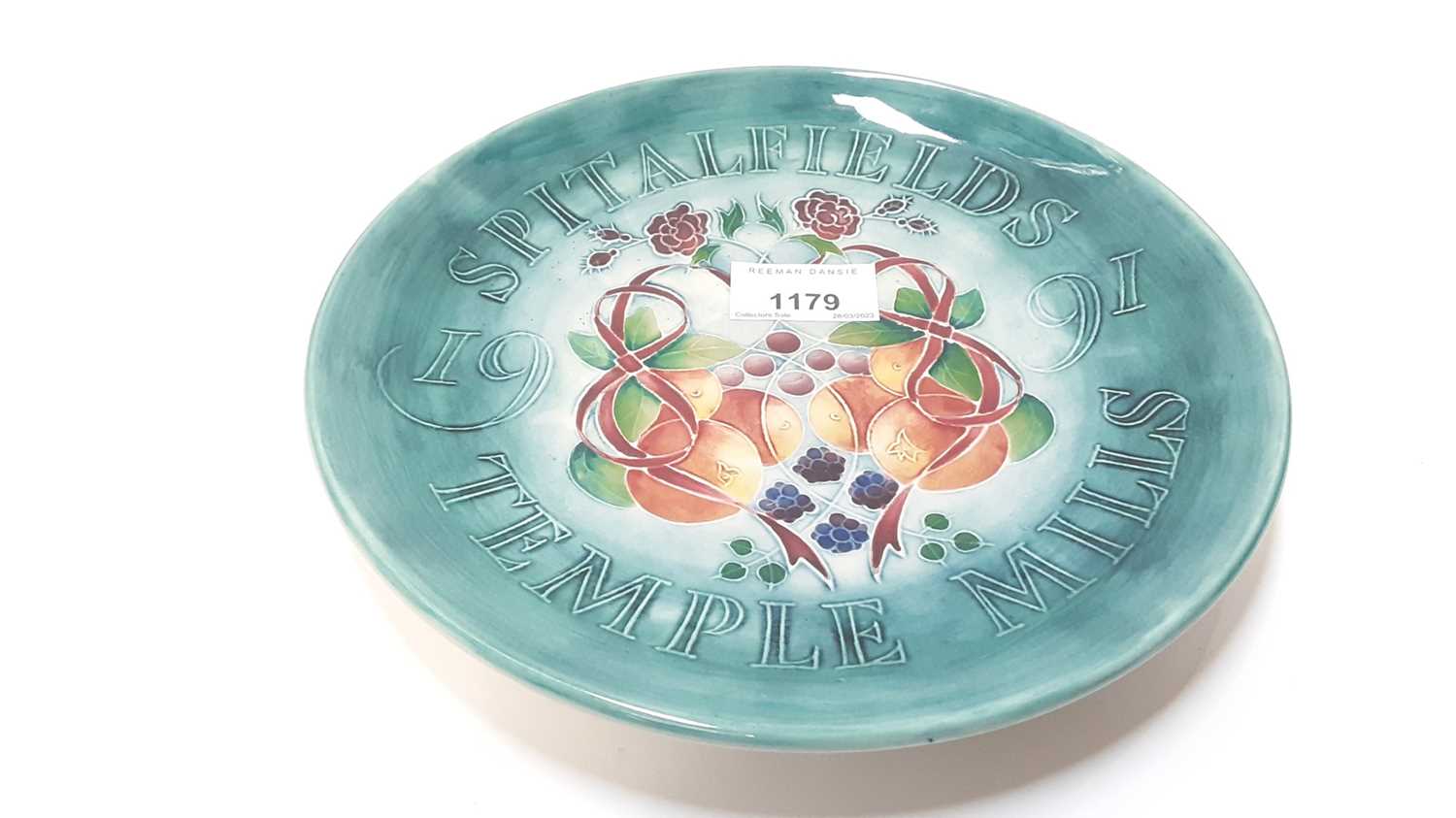Lot 1179 - Moorcroft pottery Spitalfields Temple Mills plate 1991, decorated with fruit, 22cm diameter