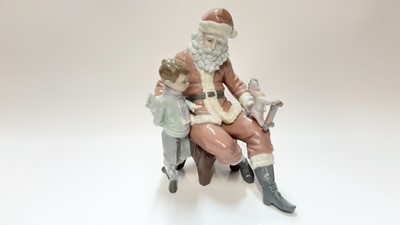 Lot 1181 - Lladro porcelain figure group - Santa Claus and young boy