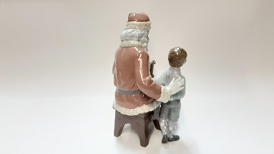 Lot 1181 - Lladro porcelain figure group - Santa Claus and young boy