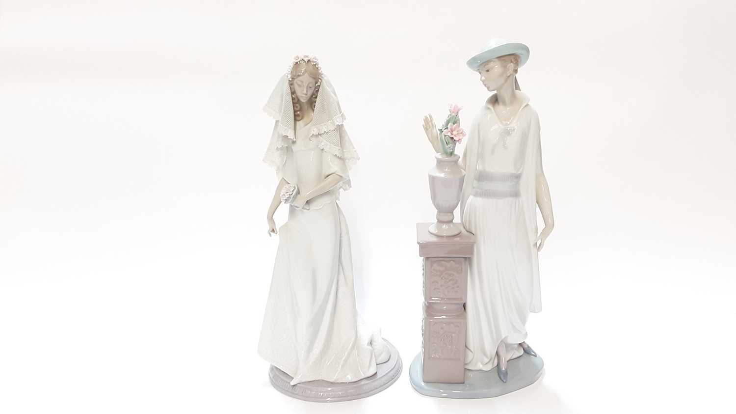 Lot 1183 - Lladro porcelain figure - Bridal Portrait, 1991-1995, numbered 5742, 33.5cm high, together with another Lladro lady, 35cm high (2)
