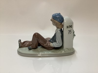 Lot 1186 - Three Lladro porcelain figures - mother and daughter 5449, girl with basket of flowers 5416 and boy resting 5399