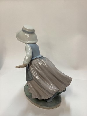 Lot 1188 - Lladro porcelain ballerina, Lladro figure of a girl with balloons, Nao figure a one other Spanish figure (4)