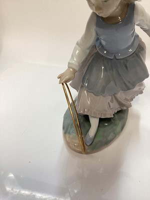 Lot 1188 - Lladro porcelain ballerina, Lladro figure of a girl with balloons, Nao figure a one other Spanish figure (4)