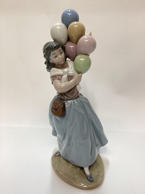 Lot 1188 - Lladro porcelain ballerina, Lladro figure of a girl with balloons, Nao figure a one other Spanish figure (4)