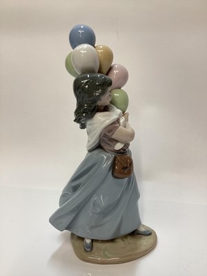 Lot 1188 - Lladro porcelain ballerina, Lladro figure of a girl with balloons, Nao figure a one other Spanish figure (4)