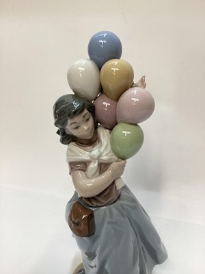 Lot 1188 - Lladro porcelain ballerina, Lladro figure of a girl with balloons, Nao figure a one other Spanish figure (4)