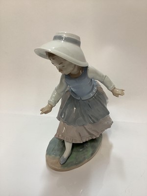 Lot 1188 - Lladro porcelain ballerina, Lladro figure of a girl with balloons, Nao figure a one other Spanish figure (4)