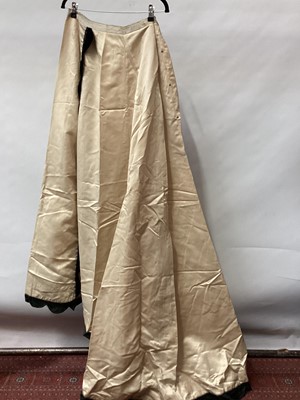 Lot 2058 - Victorian cream satin skirt with train and scalloped black velvet trim. Victorian black satin boned bodice, small button to front, pin tucks and beading.  Pointed cuffs.  Plus two Victorian beaded...