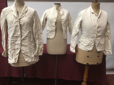 Lot 2061 - Three vintage white linen work/chore jackets plus a similar coat and white cotton jacket.