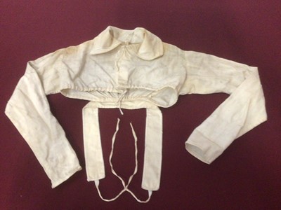 Lot 2062 - Edwardian and later children's clothing including white work christening gown and nighties, Broderie Anglaise petticoat and blouses, split leg bloomers , white grosgrain waist coat and breeches, bl...