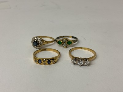 Lot 106 - 18ct gold diamond three stone ring, together with three other 18ct gold and gem-set dress rings (4)
