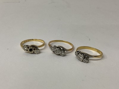 Lot 105 - Three 18ct gold diamond three stone rings, each with three small diamonds in platinum illusion setting, ring sizes Q 1/2, N and N 1/2 (3)