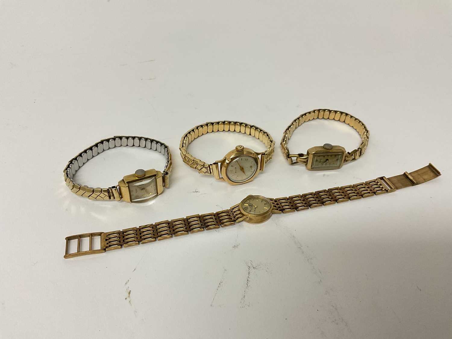 Lot 111 - Ladies 9ct gold Rotary wristwatch on 9ct gold bracelet, together with three 9ct gold cased wristwatches on plated expandable bracelets (4)