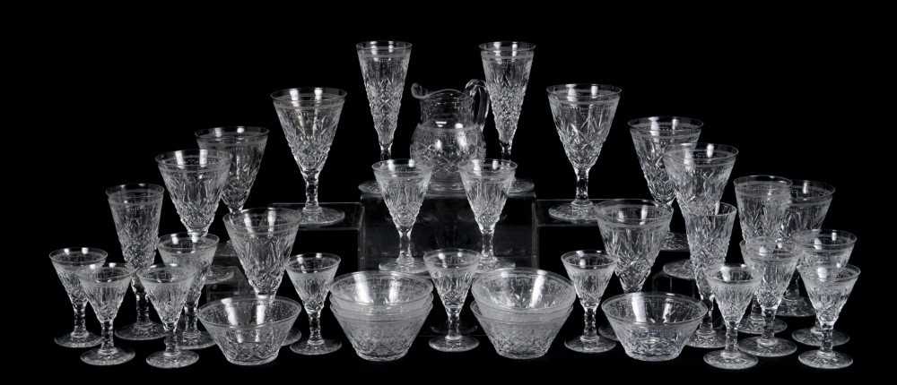 Lot 39 - Service of Edinburgh and Leith cut crystal glassware including nine red wine glasses, four champagne flutes, five port glasses, eight sherry glasses, eight finger bowls and a jug