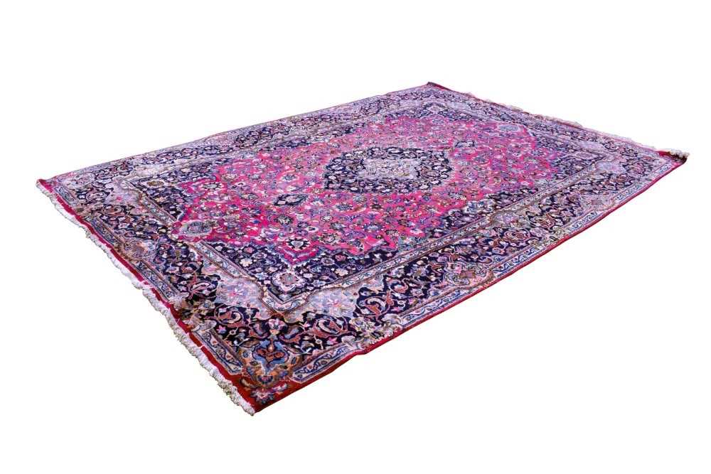 Lot 1520 - Large Heriz design  rug on red ground