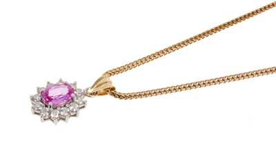 Lot 451 - Pink sapphire and diamond cluster pendant in 18ct gold setting on a 9ct gold chain