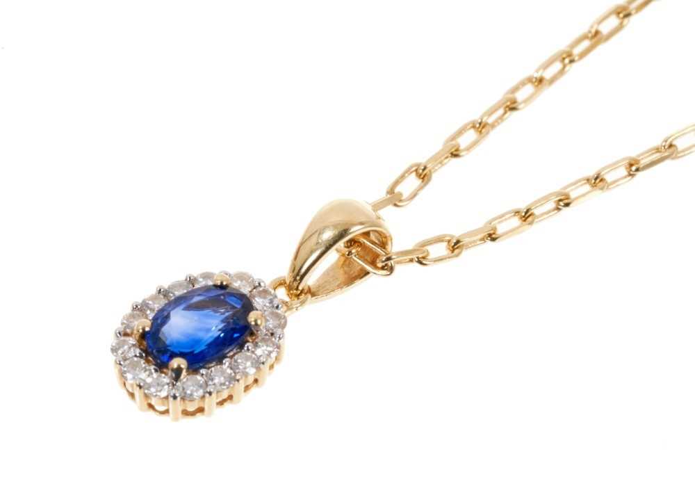Lot 452 - Blue sapphire and diamond cluster pendant in 18ct gold setting on 9ct gold chain