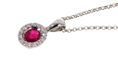 Lot 453 - Ruby and diamond cluster pendant in 18ct white gold setting on 9ct gold chain