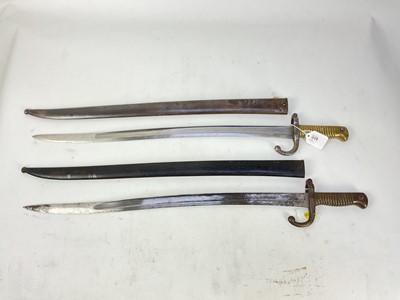 Lot 879 - Two French 1866 pattern Chassepot bayonets with scabbards (2)