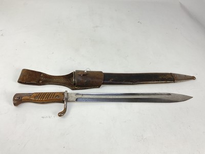 Lot 865 - First World War Imperial German K98/05 ‘Butcher’ bayonet with wooden grips and steel blade stamped Dukopp Werke A.G., in steel mounted leather scabbard with frog.