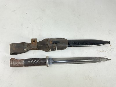 Lot 870 - Second World War Nazi German M84/98 bayonet with steel blade stamped 41crs, in steel scabbard with leather frog.